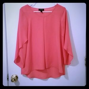 Coral colored blouse